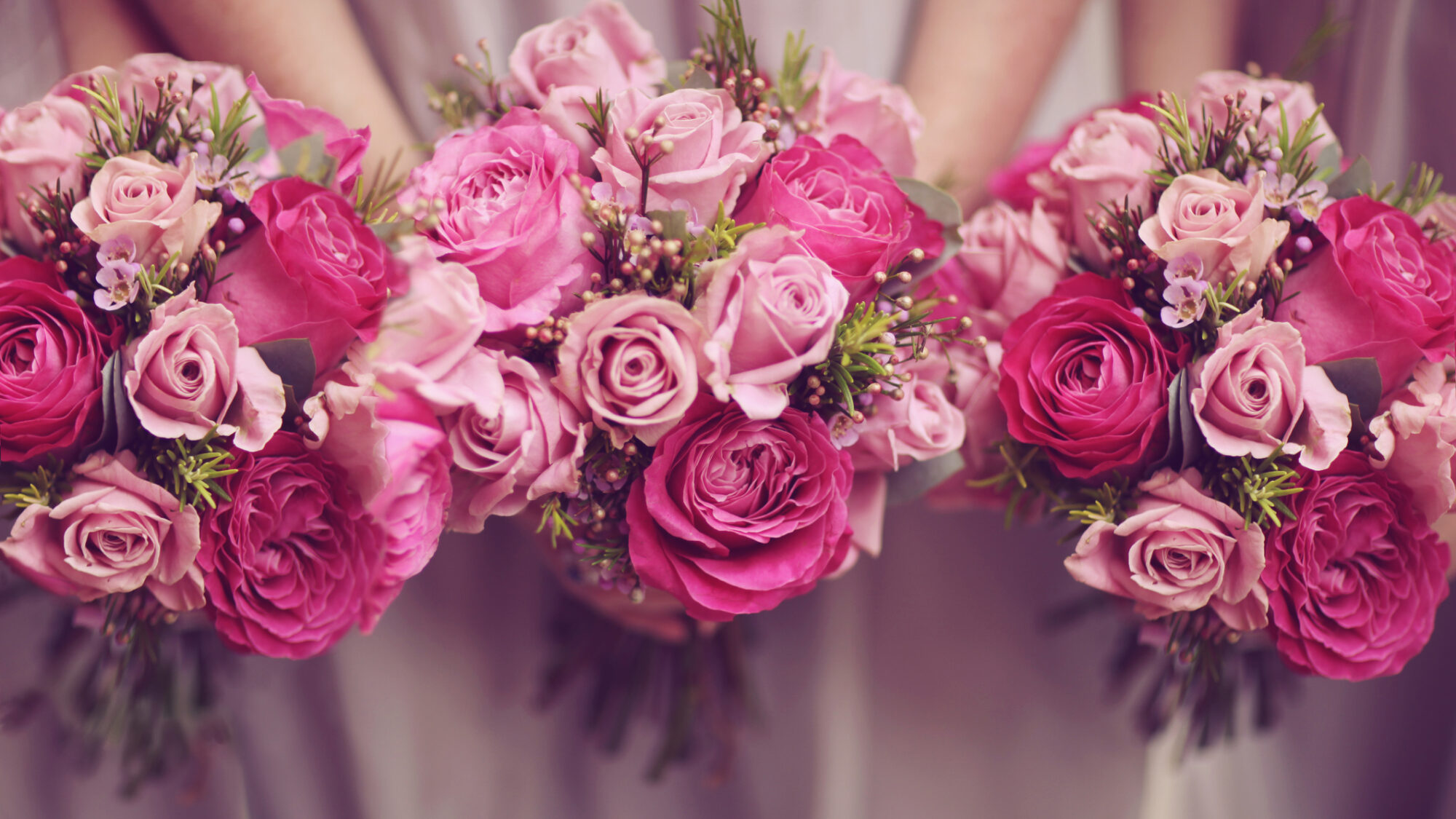 Trio of pink bridesmaid posies and roses