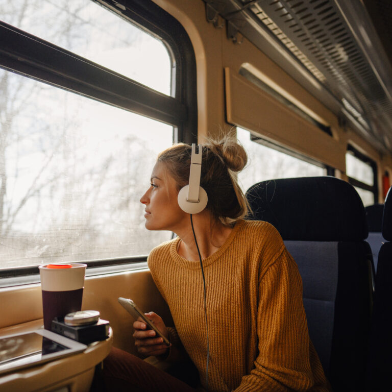 Young woman riding a train